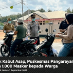 Dampak Kabut Asap, Puskesmas Pangarayan Bagikan 1.000 Masker kepada Warga